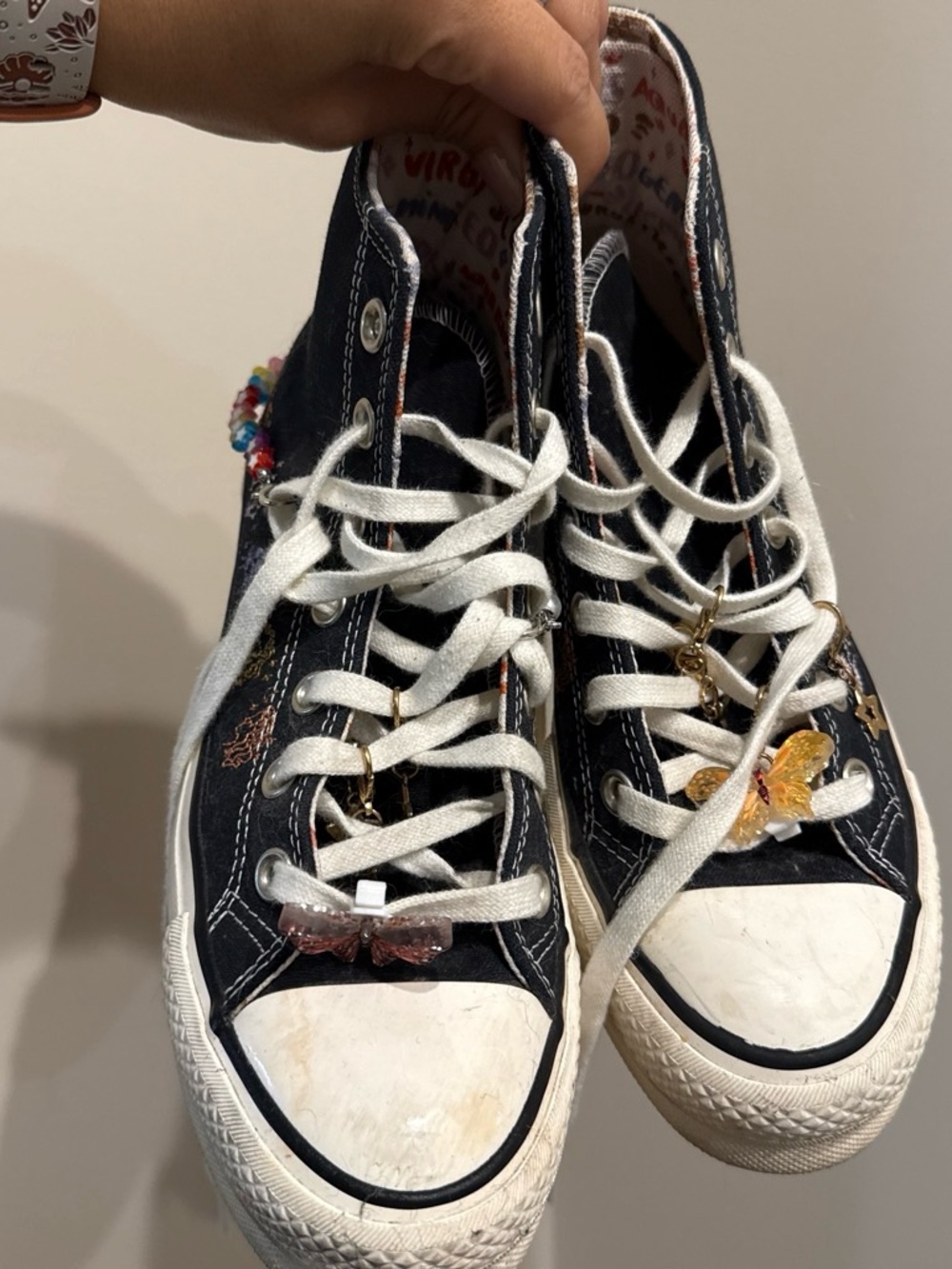 Black High-Top Converse Sneakers with Star Signs
